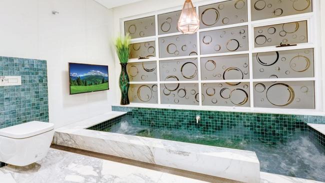 The home boasts five bathrooms, including this one. Picture: Surething Realty