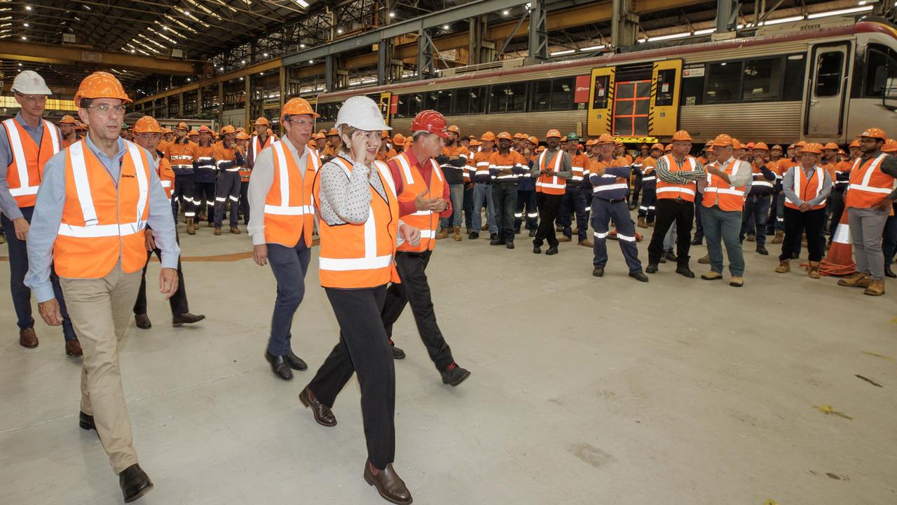 Premier Annastacia Palaszczuk leads ministers including Mark Bailey (left) on a tour of the Downer rail manufacturing facility at Maryborough.