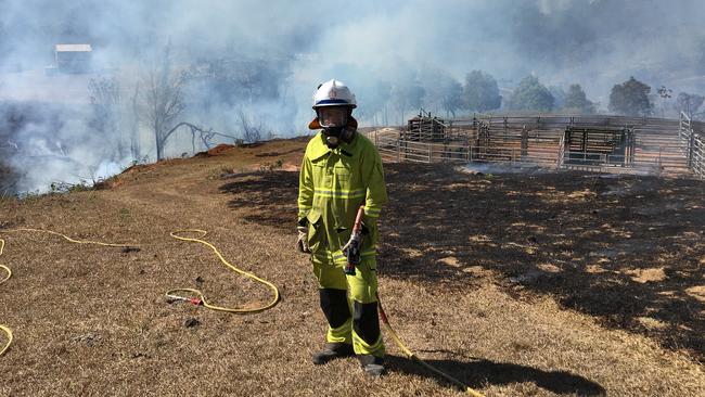 QFES firefighter Les Wilson pictured at Crediton as fires raged across the area, and the region.