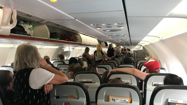 Passengers on board Melbourne to Hobart Jetstar flight JQ713, which was been stuck on the tarmac at Hobart Airport for about three hours. Picture: SUPPLIED