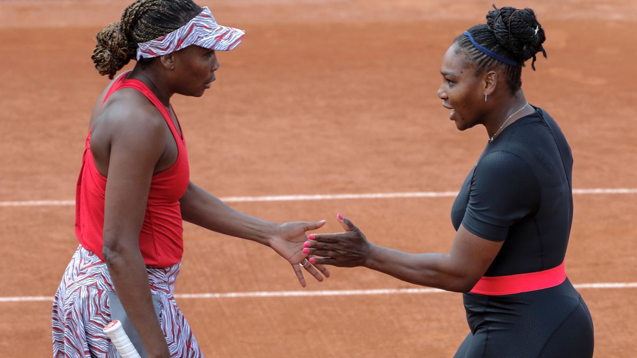 Venus Williams (L) and sister Serena will face off again – 22 years after their incredible first match.