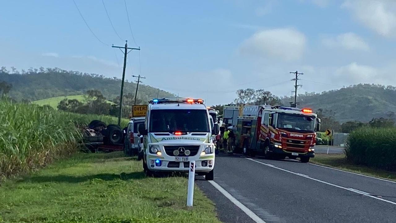 A truck driver is pinned inside a crushed truck cabin after it rolled into a cane paddock near Oakenden on Eton Homebush Rd, February 18, 2022. Picture: Matthew Forrest