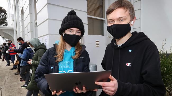 Brother and sister Emily, 16, and Ben Sparrow, 18, waiting to get vaccinated. Picture: David Caird
