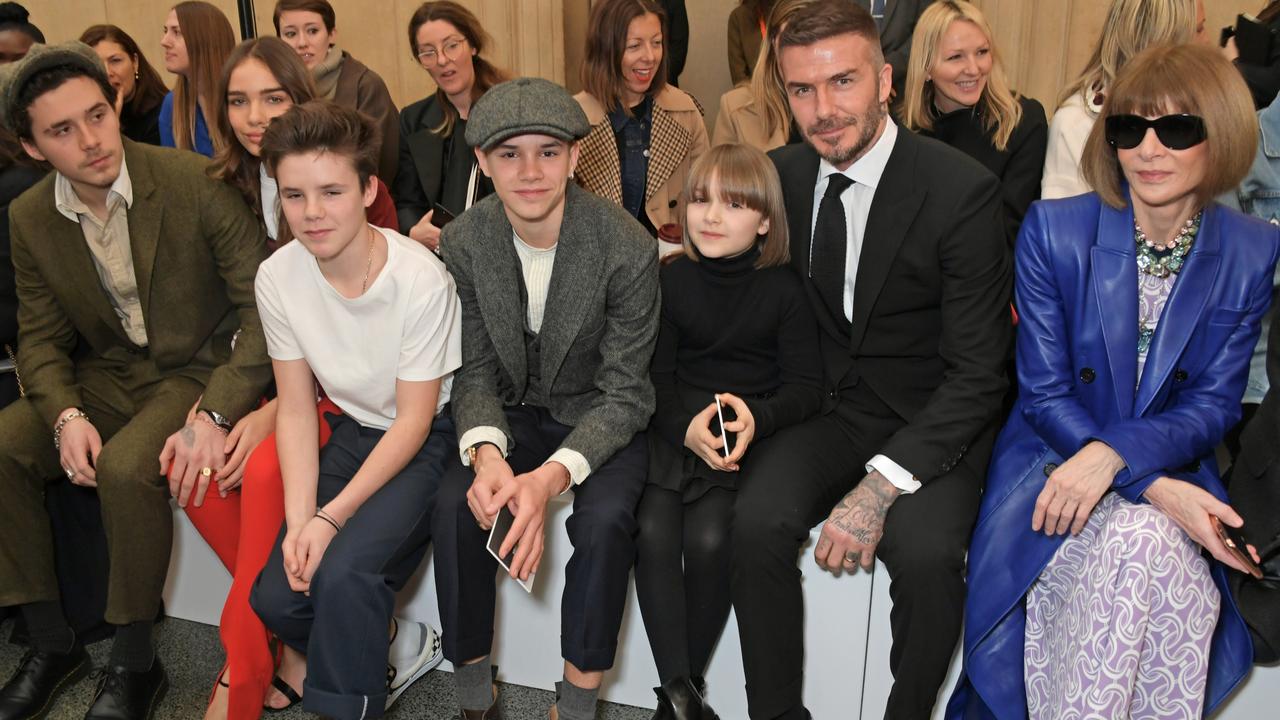 Brooklyn (with girlfriend Hana Cross), Cruz, Romeo, Harper and David Beckham, with Anna Wintour in the front row. Picture: Getty Images