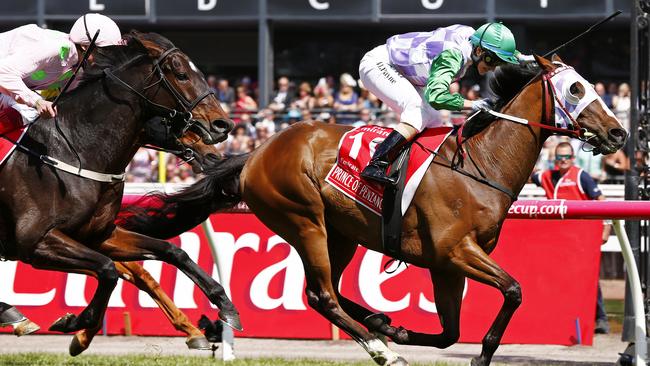 Michelle Payne wins the Melbourne Cup on Prince Of Penzance in front of Max Dynamite. Picture: Colleen Petch