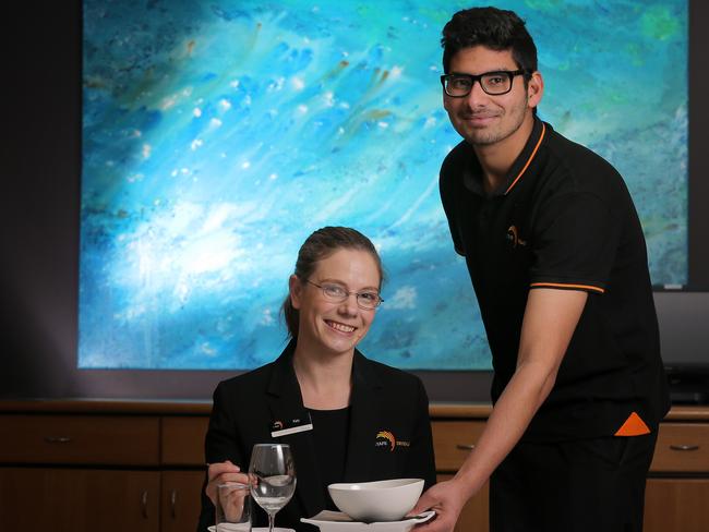 Certificate 3 in Hospitality student Kamal Parmar serves Restaurant Manager Kate Delaney. TasTAFE Drysdale and Tasmanian Hospitality Association agreement to work on better standards and numbers of graduates