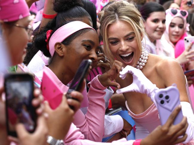 Margot Robbie takes a selfie with fans in Leicester Square. Picture: Tristan Fewings/Getty Images