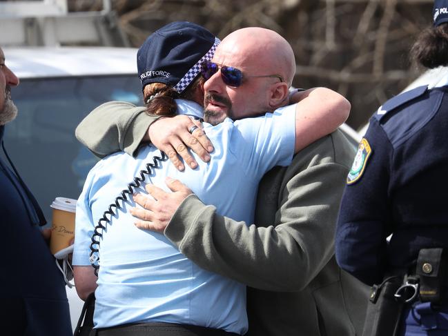 Exaven Desisto, the father of Antonio, is embraced as he leaves court after the driver of the car in which his son died was refused bail on Thursday. Picture: John Grainger