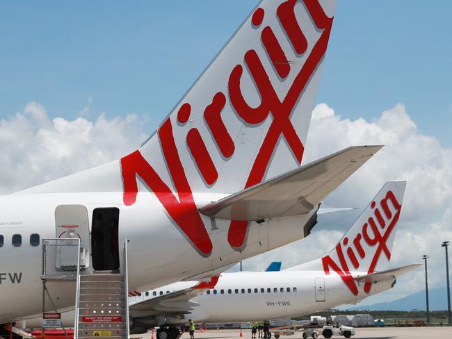 A Virgin Australia Boeing 737 passenger jet aircraft on the tarmac apron at Cairns Airport. Picture: Brendan Radke