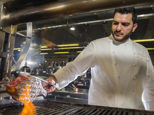 The meat is smoked, then cooked while being basted with fat, then roasted in charcoal and rested for 10 minutes before being served. Picture: Dylan Robinson