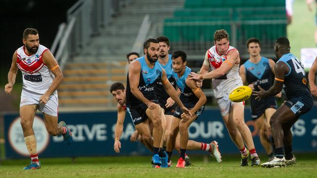 Round 17 NTFL: Darwin Buffaloes v Waratah at TIO Stadium. Jarrod Stokes gets a handpass off to Michael Coombes. Photograph: Che Chorley