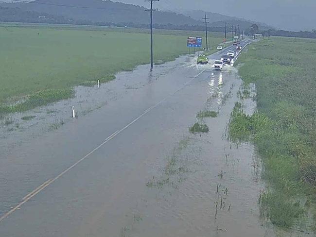 Water over Shute Harbour Road at Hamilton Plains on Thursday.