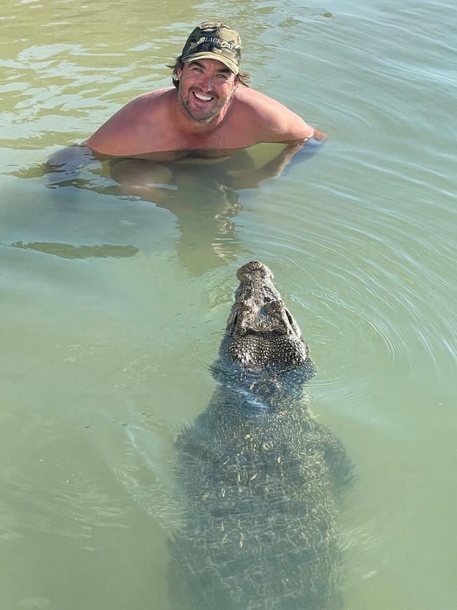 Crocodile Wrangler Matt Wright takes a dip with resident croc Claudia at his Tiwi Island Retreat last week. Picture: Matt Wright