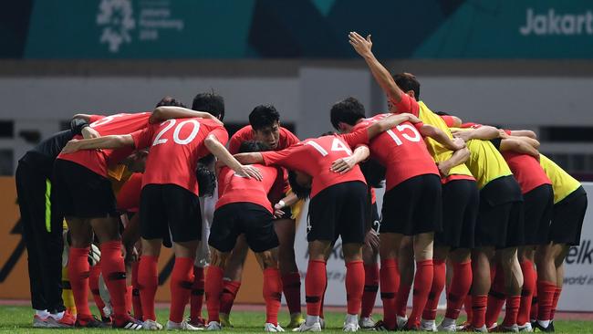 South Korea's captain Son Heung Min (C back) celebrates with teammates