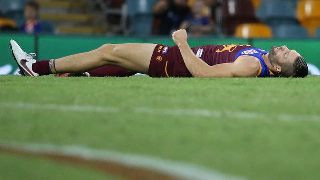 Stef Martin knocked out in the centre of the Gabba. Picture: Jono Searle