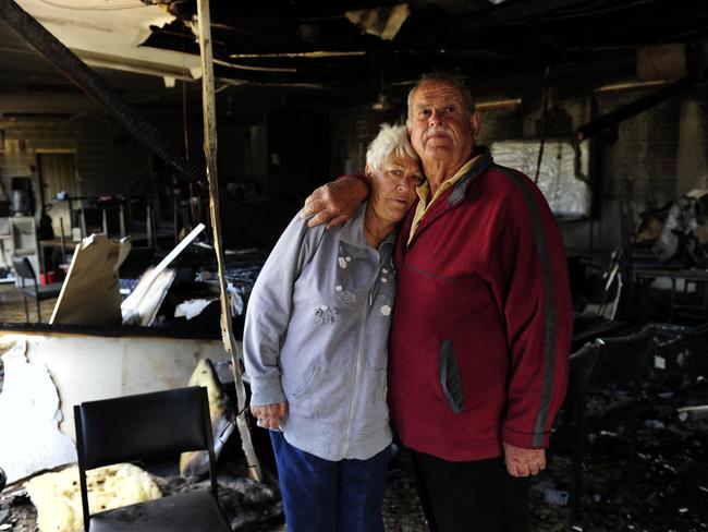 UPSET: Club president Barry McDougall, brother of Brad, with wife Bronwyn in the burnt-out clubrooms last year.