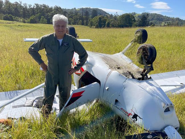 Pilot Vic Pisani next to his crash plane which he was forced to land in a paddock at Melawondi after the engine cut out, captured by Matt Frost