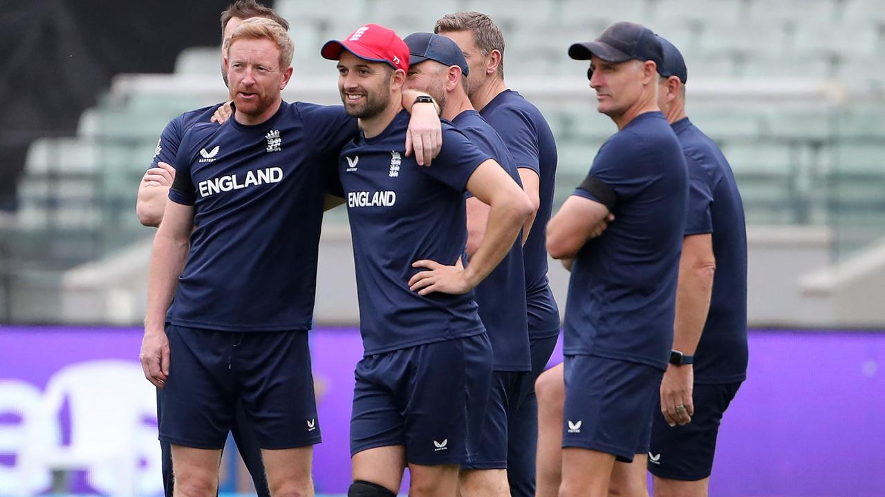 England's Mark Wood (C) attends a warm up session prior to the match.