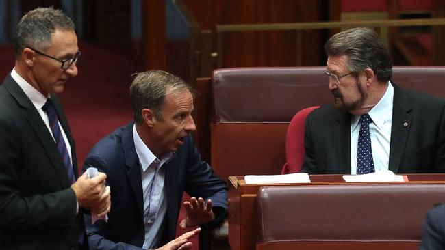 Richard Di Natale and Nick McKim talk to Derryn Hinch. Picture: Kym Smith