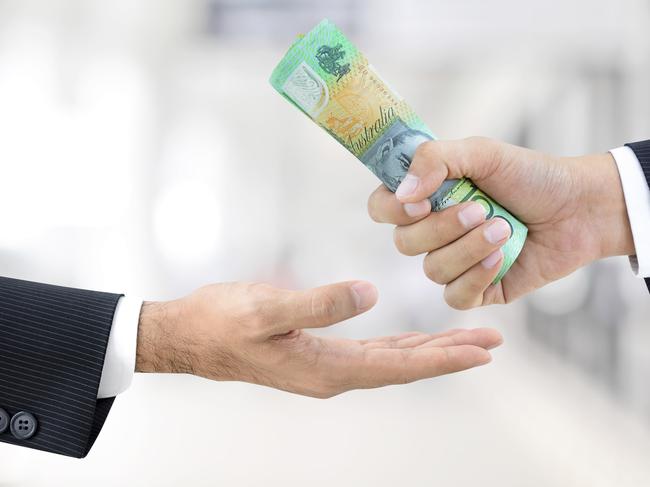 Businessman hands passing money, Australian dollar bills, tax refund generic