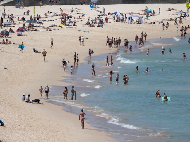 People enjoying Bondi Beach on a summer day in Sydney. Visitors from the Northern Hemisphere love coming to NSW for an escape to the sun. Picture: NCA NewsWire / James Gourley