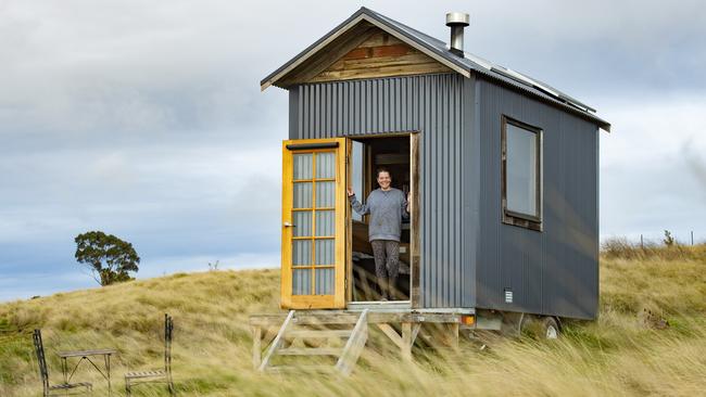 Sarah Ajzner and one of the tiny homes. PICTURE: ZOE PHILLIPS