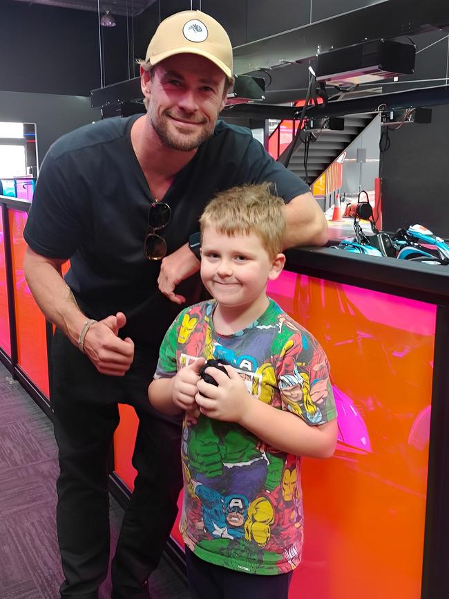 Jackson Fletcher, 7, of Cygnet meets real-life superhero Chris Hemsworth at Hyperdrive Kart Racing at Kingston on April 22, 2023.