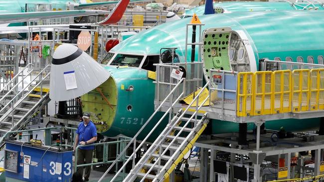 The MAX crisis and coronavirus pandemic have prompted Boeing to cut production. A Boeing 737 MAX on the assembly line in 2019. Picture: Ted S. Warren/Associated Press