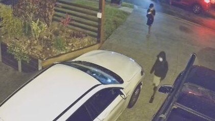 Thieves attempting to break into a car at a Murrarie home last year. Picture: Supplied.