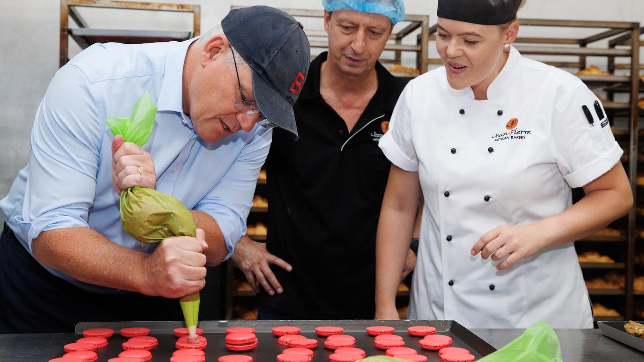 Scott Morrison tries his bakery skills in the Townsville seat of Herbert, visiting the Jean-Pierre Wholesale Artisan Bakery with local Federal Member Phillip Thompson. Picture: Jason Edwards