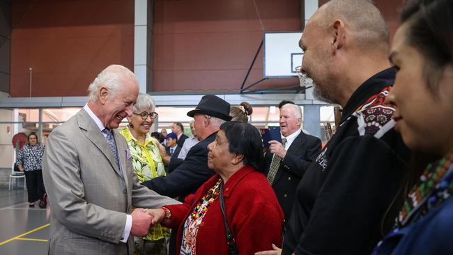 Britain King Charles III meets with members of the indigenous community during a visit to the National Centre of Indigenous Excellence in Sydney on October 22, 2024. (Photo by Lisa Maree Williams / POOL / AFP)