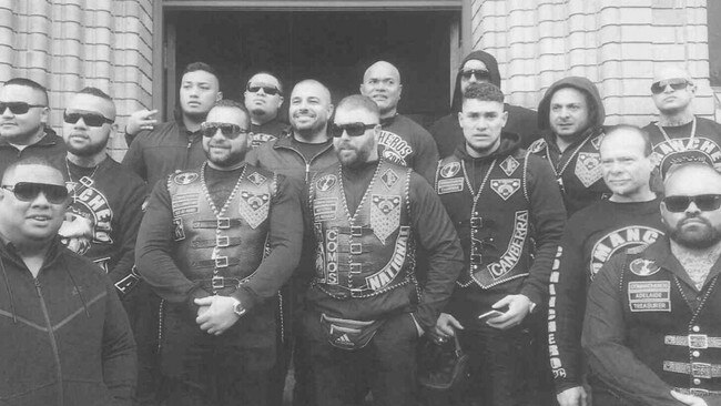 Pitasoni Ulavalu (centre rear) pictured with other senior Australian gang office holders, was stabbed and killed at Kokomo's nightclub in Canberra