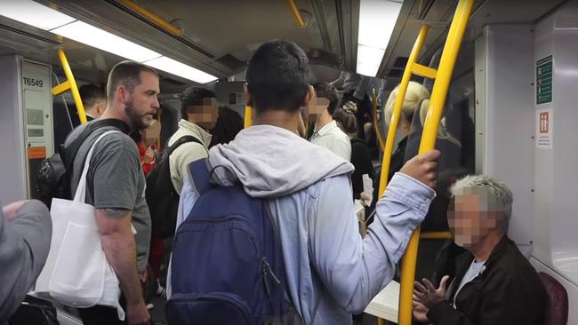 The anti-abortion activist (left) and a passenger (right) have a heated exchange.