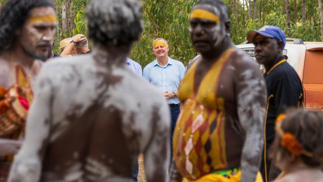 Prime Minister of Australia Anthony Albanese watches Yolngu People prepare for opening ceremony during the Garma Festival 2022 at Gulkula. Picture: Tamati Smith/ Getty Images