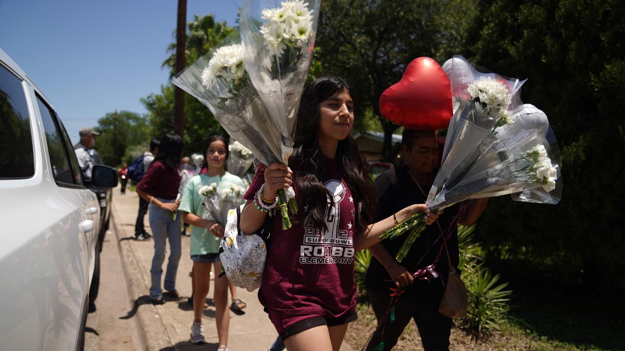 People have created a makeshift memorial outside the Robb Elementary School, where the shooting occurred. Picture: Allison Dinner/AFP