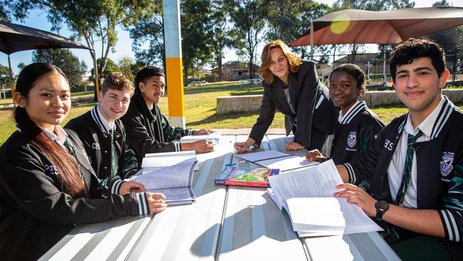 (L-R) Aniken Petelo (17), Abdulrahman Rifaih (17), Mariam Tarawally (18), Hassan Farhat (17) and Bathsheba Sein (17), and Principal Susie Mobayed at Condell Park High School. Picture: Christian Gilles