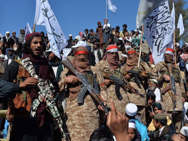 TOPSHOT - Afghan Taliban militants and villagers attend a gathering as they celebrate the peace deal and their victory in the Afghan conflict on US in Afghanistan, in Alingar district of Laghman Province on March 2, 2020. - The Taliban said on March 2 they were resuming offensive operations against Afghan security forces, ending the partial truce that preceded the signing of a deal between the insurgents and Washington. (Photo by NOORULLAH SHIRZADA / AFP)