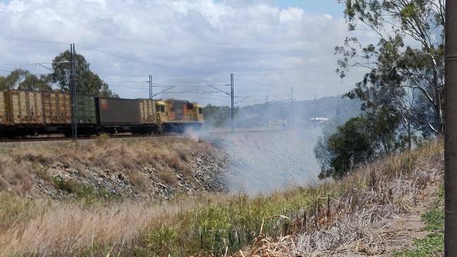 A fire that jumped Gladstone Benaraby Road at Glen Eden has shut the road to traffic. Picture: Rodney Stevens