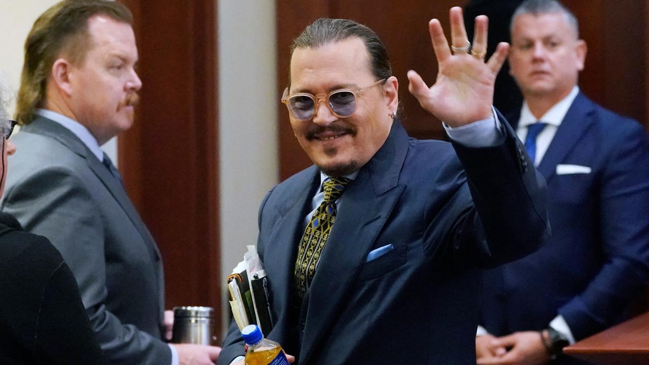 Johnny Depp is known to gesture to the gallery as he leaves the courtroom for a break. Picture: Steve Helber / POOL / AFP