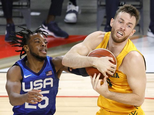 LAS VEGAS, NEVADA - JULY 12: Nick Kay #15 of the Australia Boomers grabs a rebound against Darius Garland #25 of the United States during an exhibition game at Michelob Ultra Arena ahead of the Tokyo Olympic Games on July 12, 2021 in Las Vegas, Nevada. Australia defeated the United States 91-83.   Ethan Miller/Getty Images/AFP == FOR NEWSPAPERS, INTERNET, TELCOS & TELEVISION USE ONLY ==