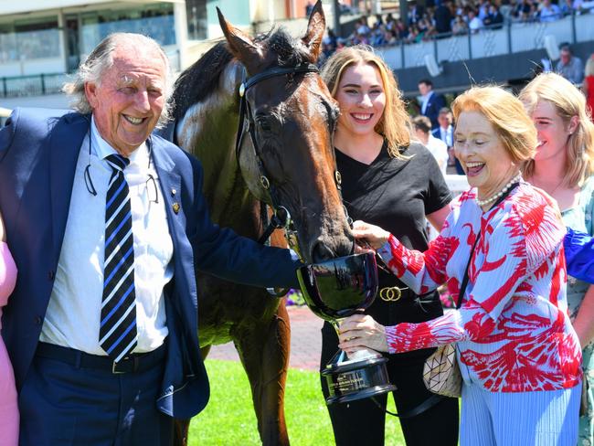 MELBOURNE, AUSTRALIA - FEBRUARY 26: Damien Oliver poses with trainer Gai Waterhouse and owner John Singleton after riding Castlereagh Kid winning Race 3, the Stow Storage Solutions Autumn Classic, during Melbourne Racing at Caulfield Racecourse on February 26, 2022 in Melbourne, Australia. (Photo by Vince Caligiuri/Getty Images)