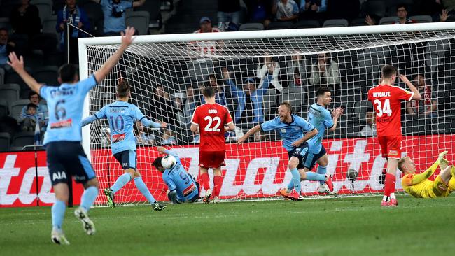 Rhyan Grant’s matchwinning overtime goal sent the Sydney FC squad into rapture. Picture: Phil Hillyard