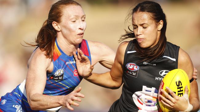 Carlton’s Brooke Walker tries to shrug off Tiarna Ernst. Picture: AAP