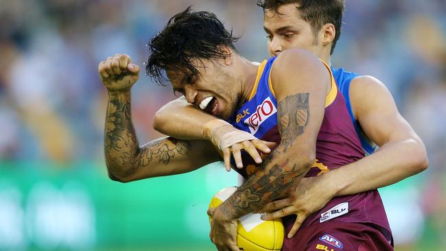 Allen Christensen shrugs a Kade Kolodjashnij tackle to win a free kick.