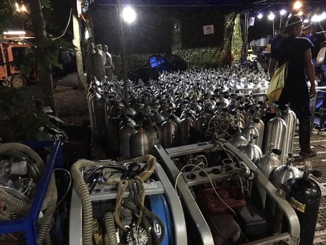 Oxygen tanks are prepared for rescue divers near the entrance of Tham Luang cave at in the Mae Sai district of Chiang Rai. Picture: AFP