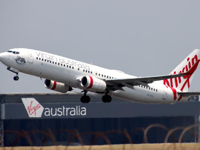 Virgin Australia plane departing from Brisbane Airport Pictures David Clark Photography