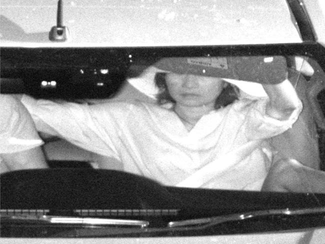 Anh Nyugen seen pulling down a visor in a photo that accompanied the fine sent to partner Richard Arnold. Picture: Glenn Hampson.