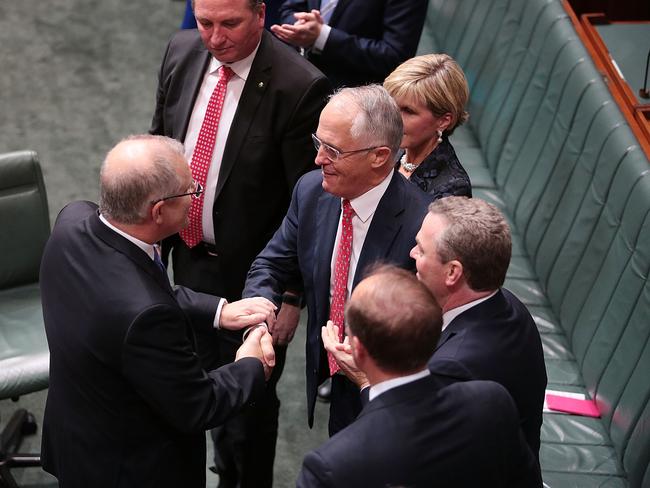 Treasurer Scott Morrison shakes hands with Prime Minister Malcolm Turnbull after delivering his budget in the House of Representatives at Parliament House. Picture: Getty