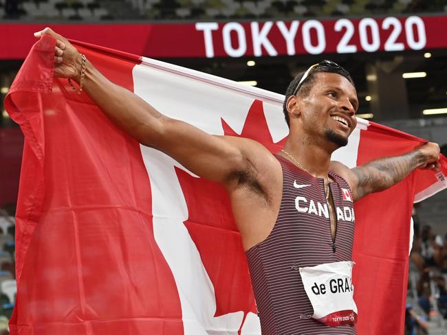 Canada's Andre De Grasse celebrates his gold medal triumph.