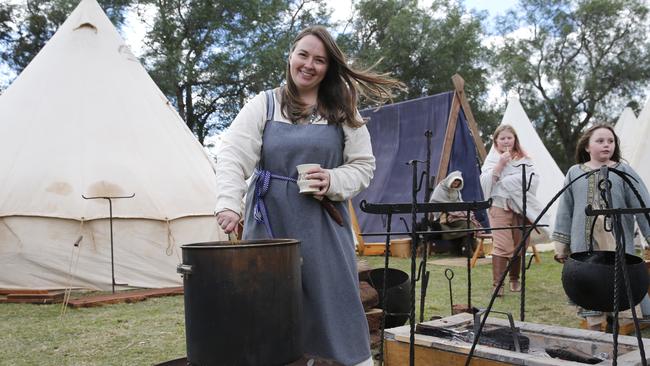 Julie Anderson is pictured creating a natural fabric dye from onion skins at Hawkesbury Showground Winterfest Medieval Festival on Saturday, July 7, 2018. The festival drew a large crowd from the Hawkesbury area who came for the food, folk music and fun. (AAP Image/David Swift)